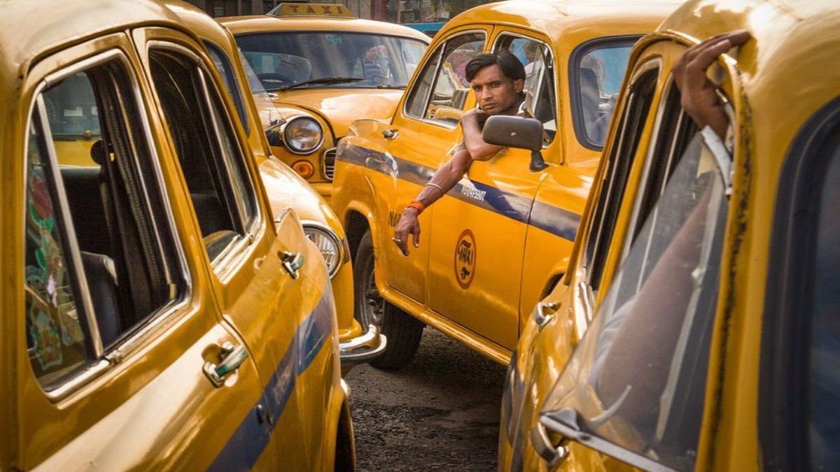 Yellow taxis on a busy Kolkata street, reflecting how nostalgia makes movies better by connecting cinema with everyday memories.